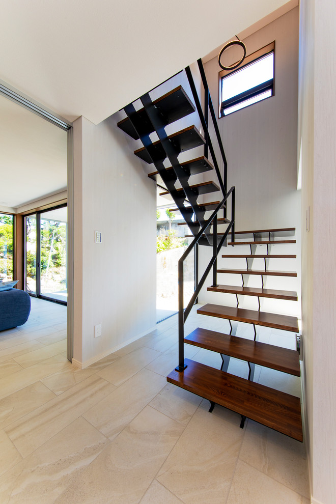 Example of a large minimalist staircase design in Other