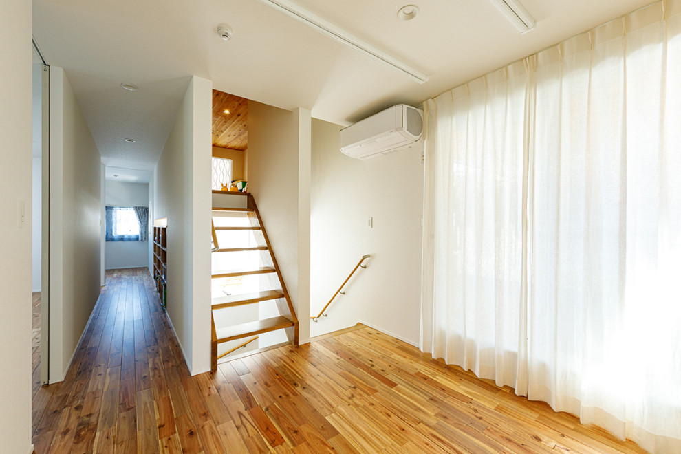 Large urban wooden straight wood railing staircase photo in Tokyo with wooden risers