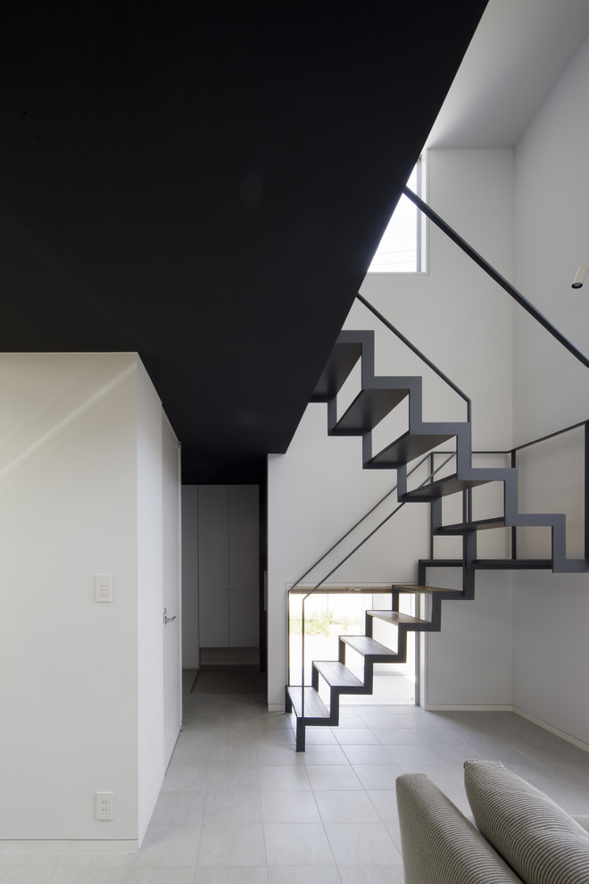 Staircase - mid-sized modern u-shaped open and metal railing staircase idea in Other