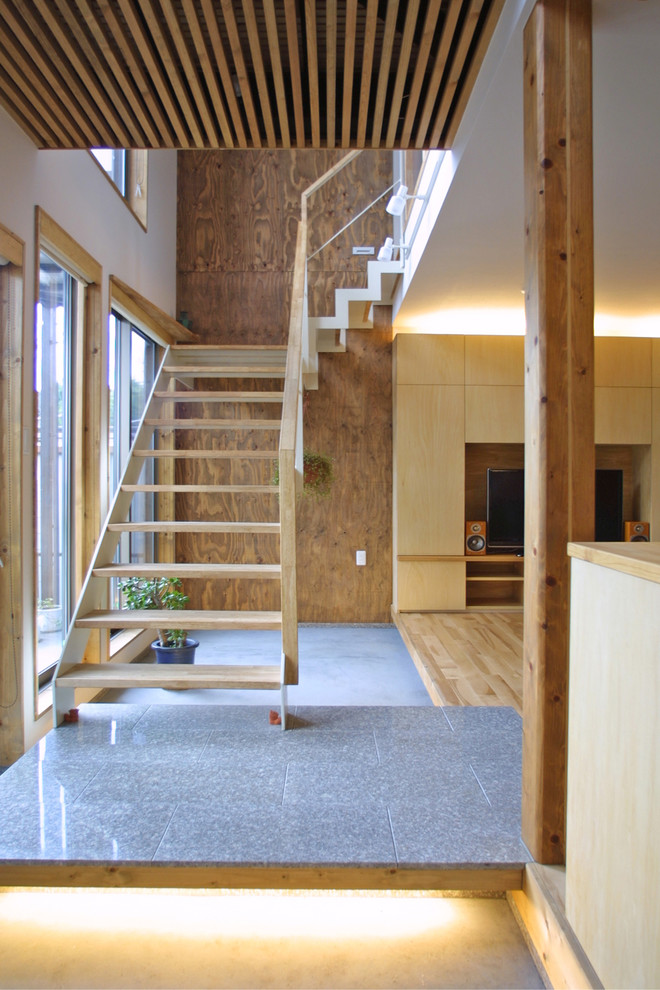 World-inspired wood staircase in Tokyo with open risers.