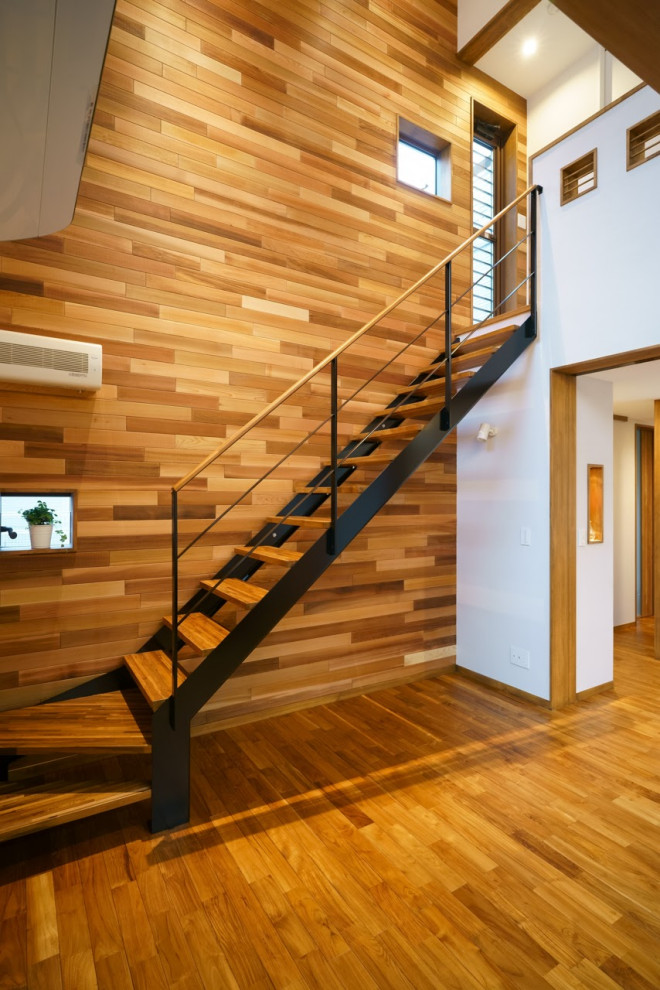 Стильный дизайн: угловая лестница среднего размера в стиле ретро с деревянными ступенями и металлическими перилами без подступенок - последний тренд