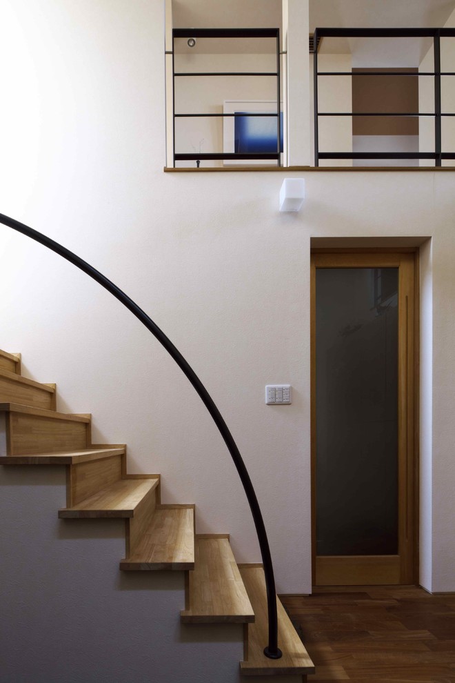 Inspiration for a contemporary wood straight staircase in Kyoto with wood risers.