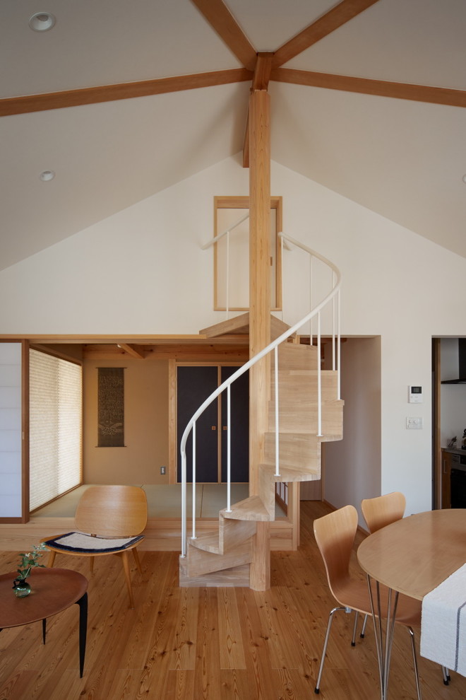 Example of a trendy wooden spiral staircase design in Other with wooden risers