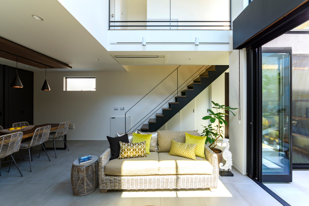 Example of a zen wooden spiral metal railing staircase design in Tokyo Suburbs