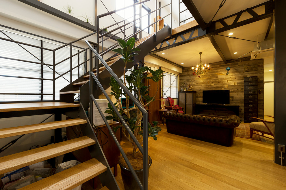 Industrial wood l-shaped staircase in Other with open risers.